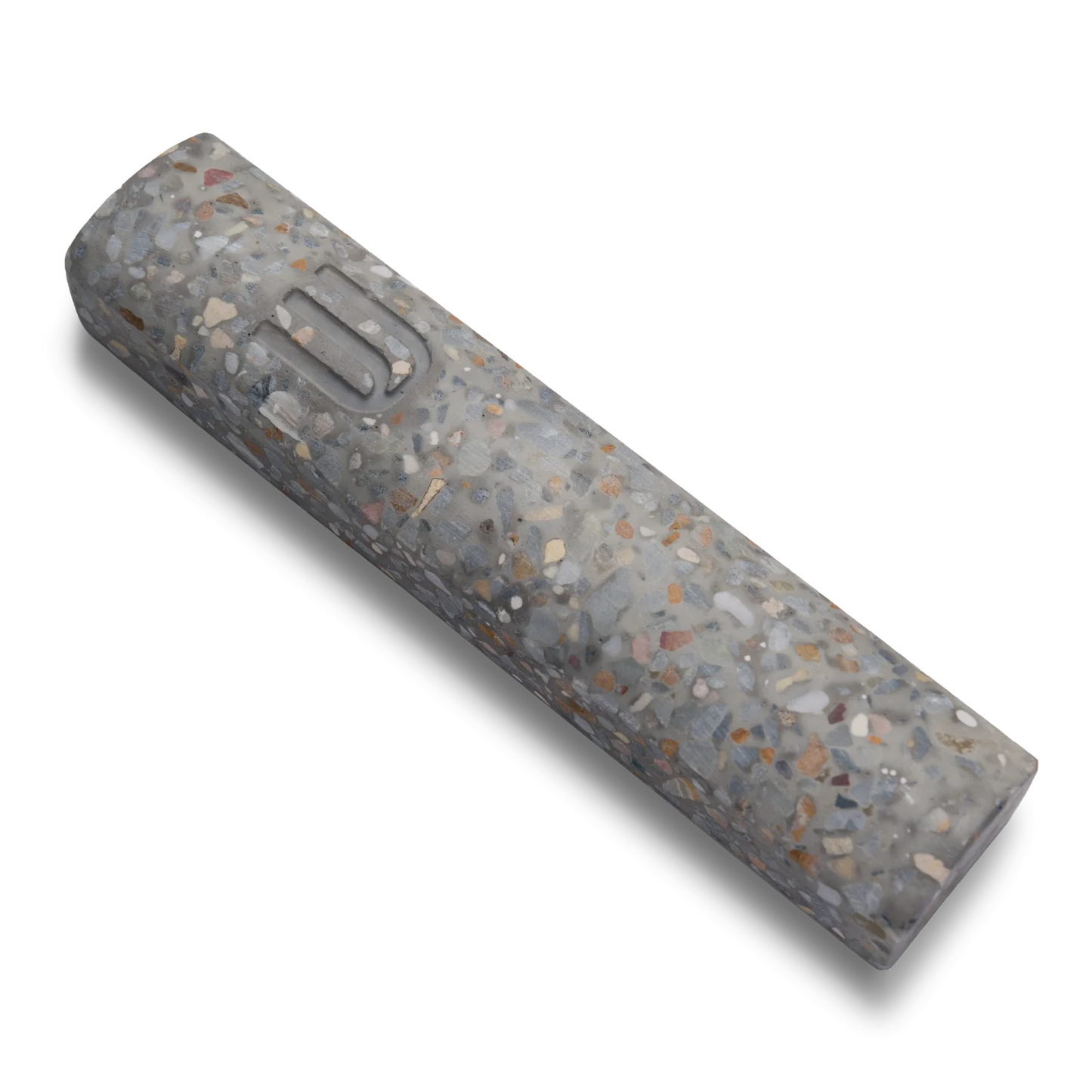 Handmade mezuzah crafted from marbled concrete, featuring Shin symbol on the front.
