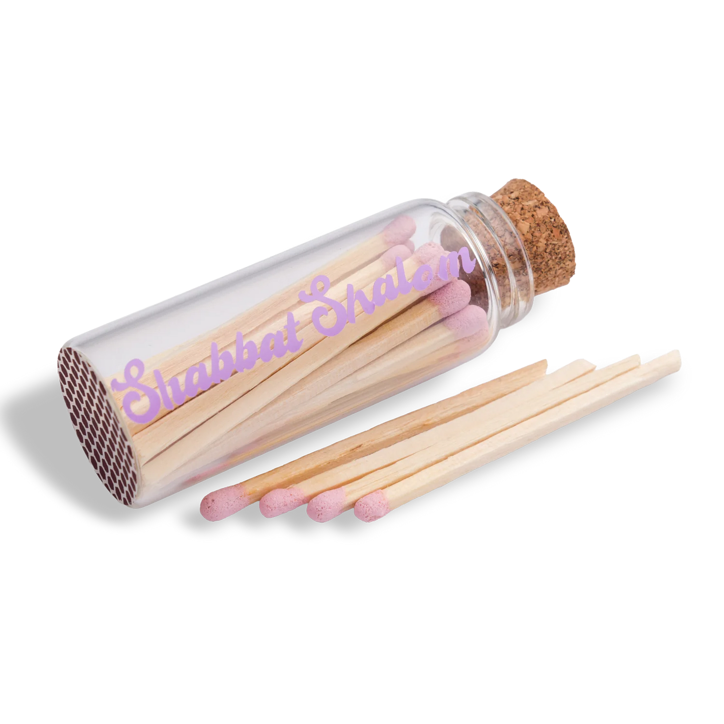 Handmade glass jar with cork lid filled with pink-tipped matches, labeled “Shabbat Shalom”