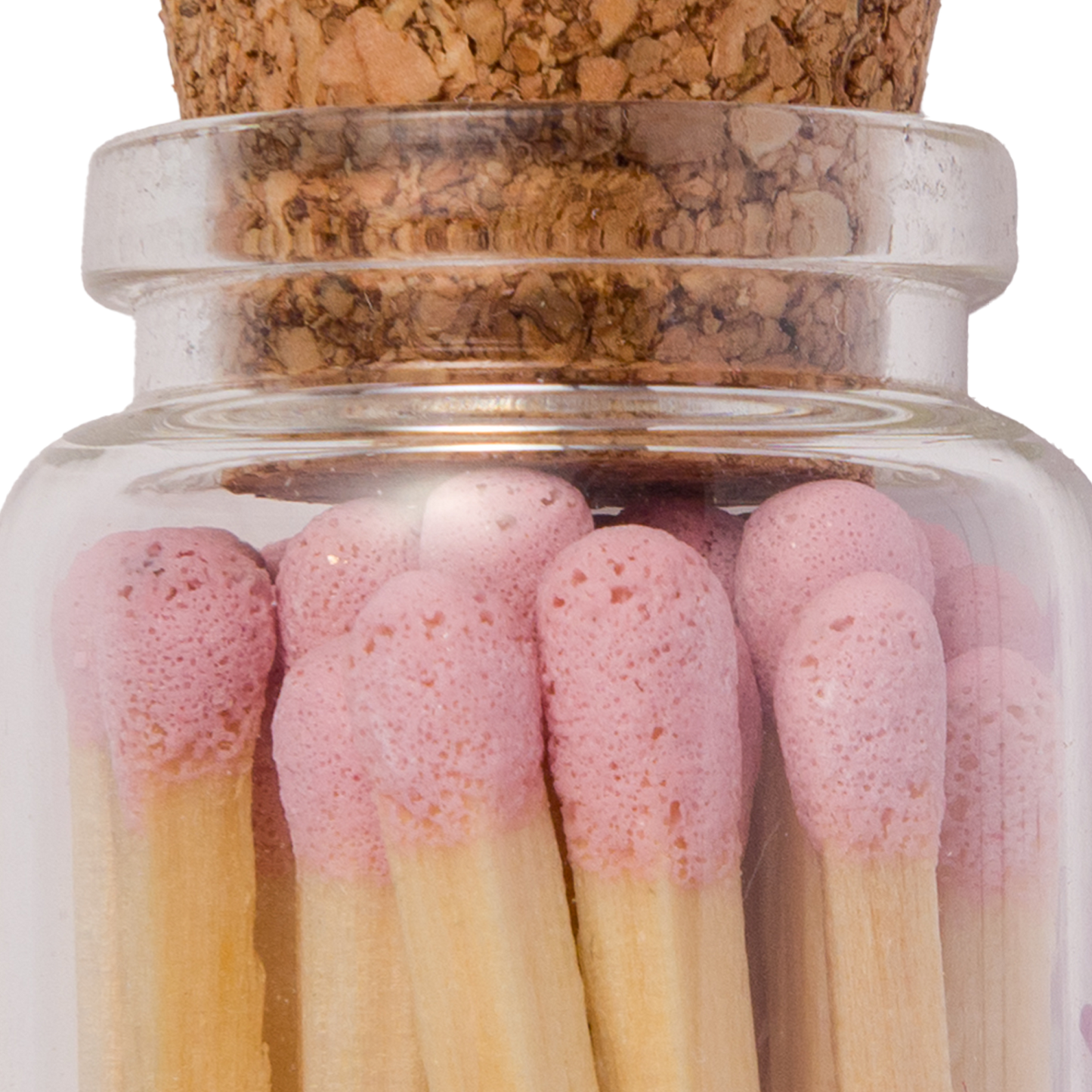Handmade glass jar with cork lid filled with pink-tipped matches, labeled “Shabbat Shalom” close-up