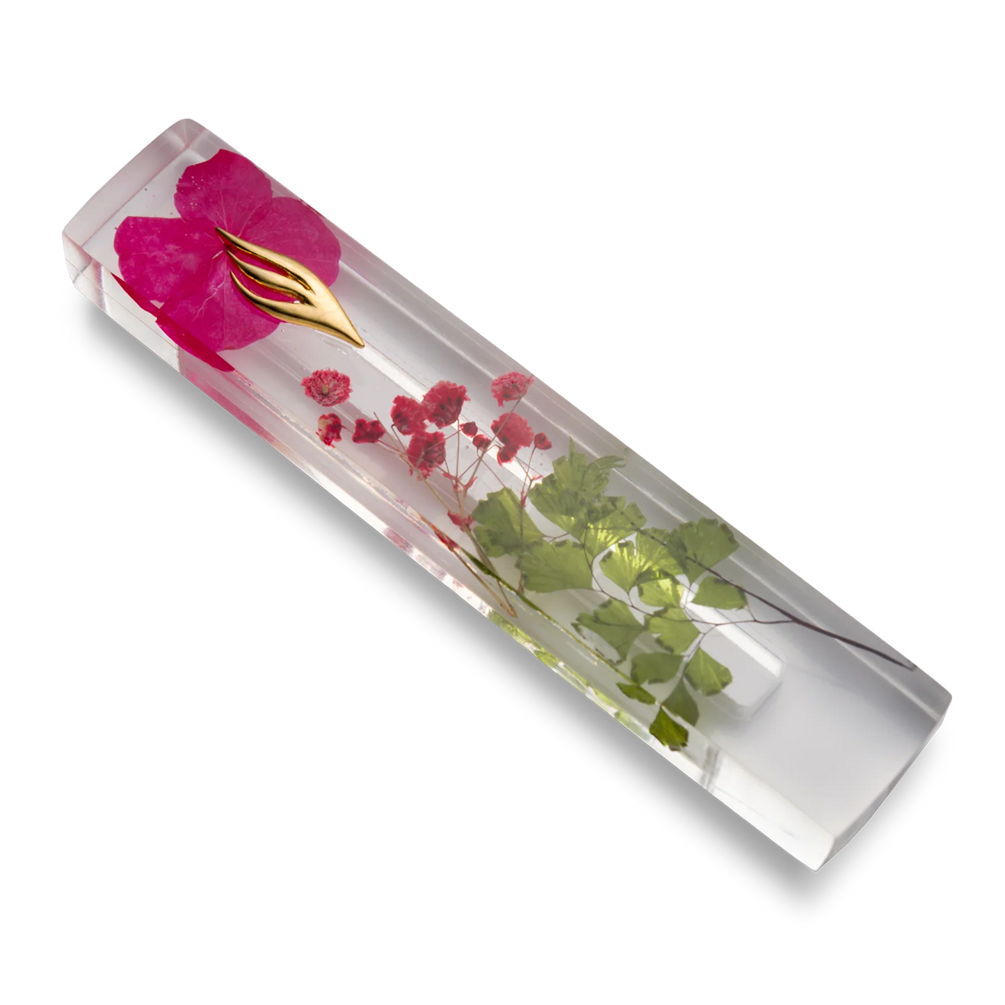 Handmade mezuzah crafted from clear resin and red preserved flowers, featuring a golden Shin symbol on the front.
