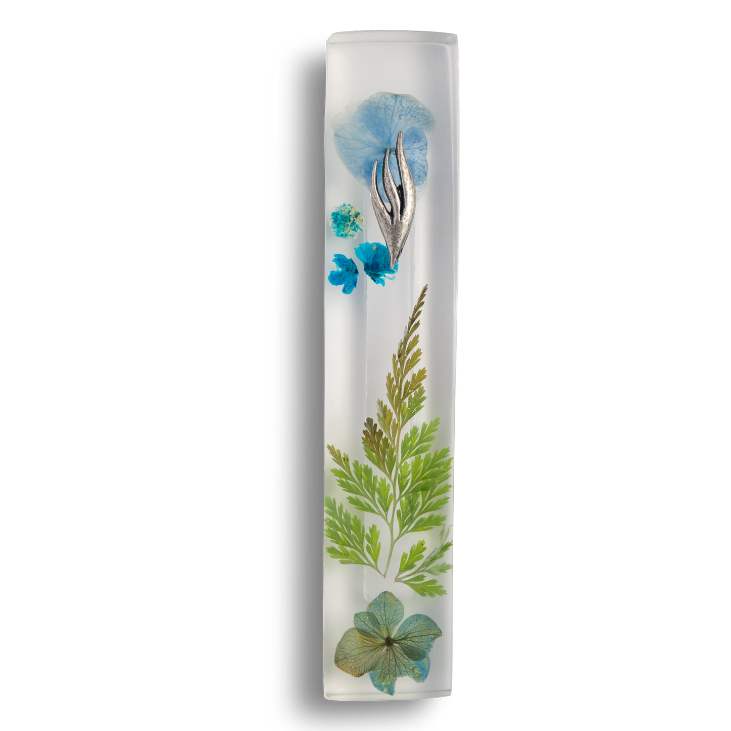 Handmade mezuzah crafted from clear resin and blue preserved flowers, featuring a silver Shin symbol on the front.