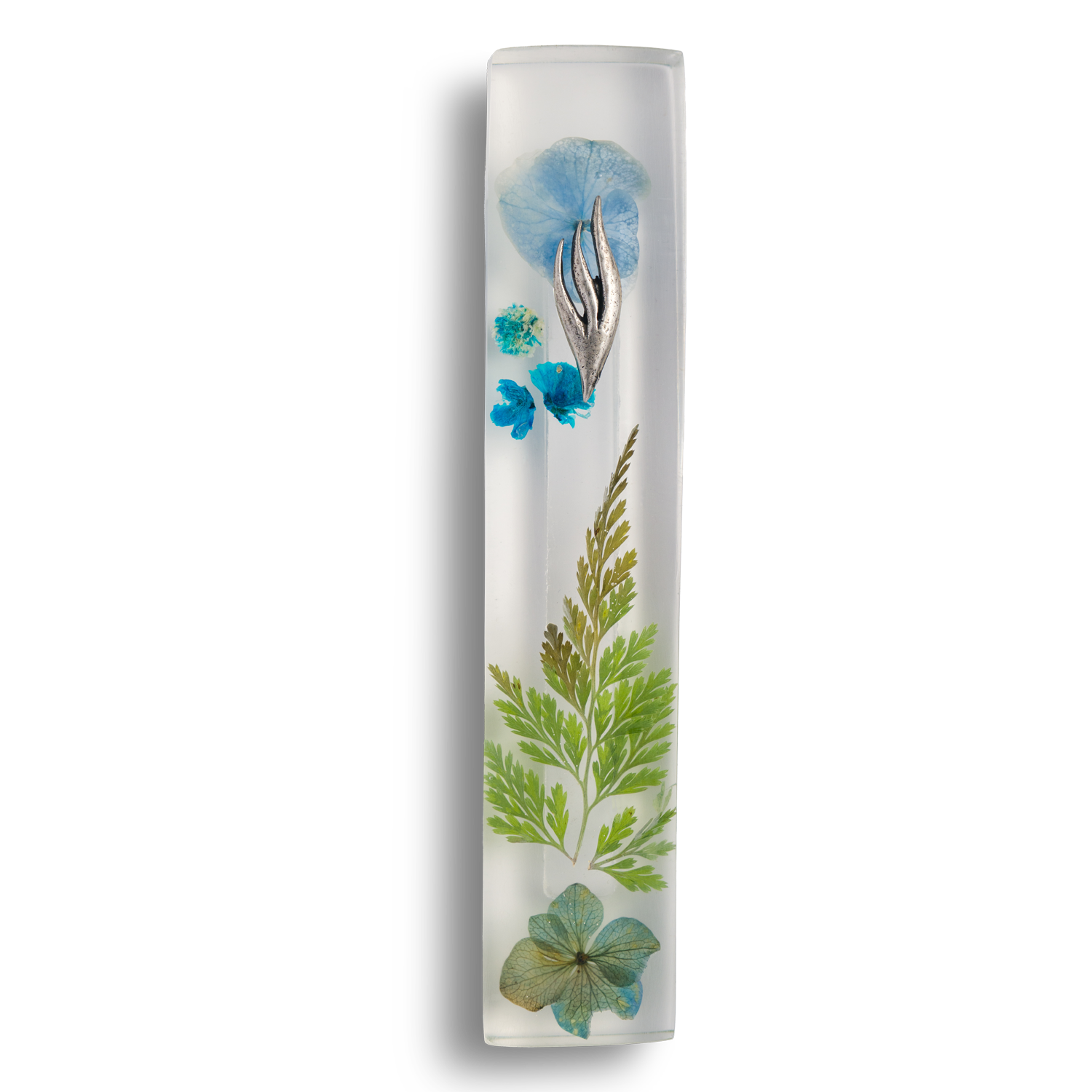 Handmade mezuzah crafted from clear resin and blue preserved flowers, featuring a silver Shin symbol on the front.