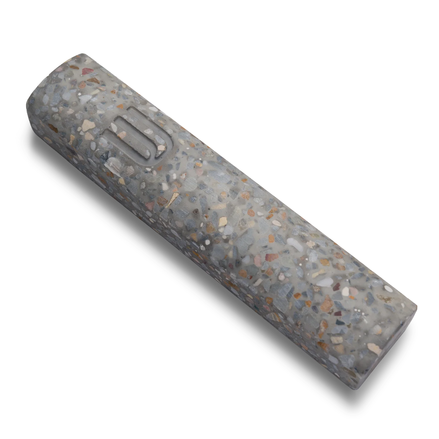 Handmade mezuzah crafted from marbled concrete, featuring Shin symbol on the front.