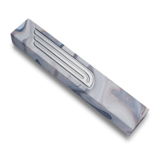 Handmade mezuzah crafted from grey marbled concrete, featuring Silver Shin symbol on the front.