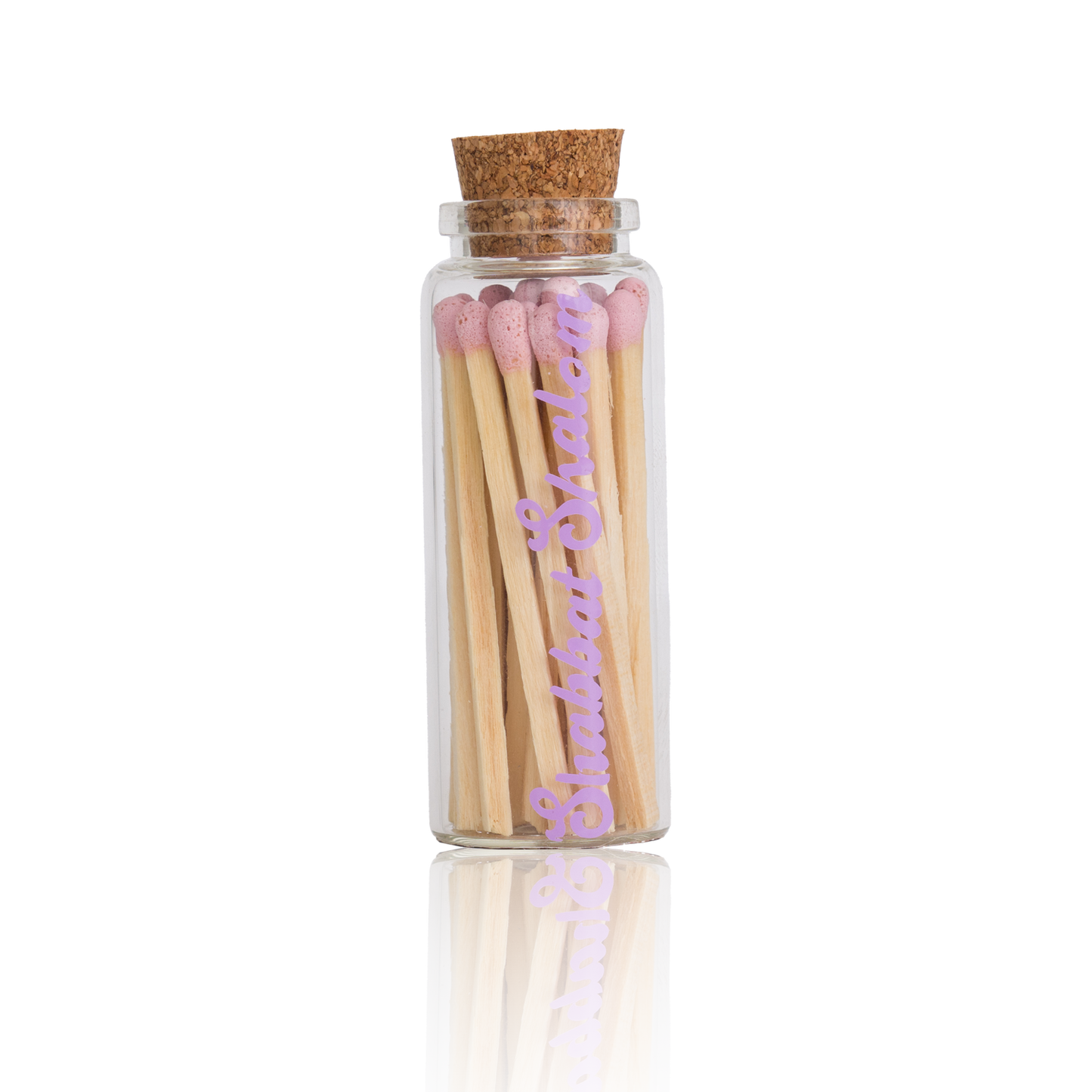 Handmade glass jar with cork lid filled with pink-tipped matches, labeled “Shabbat Shalom” 