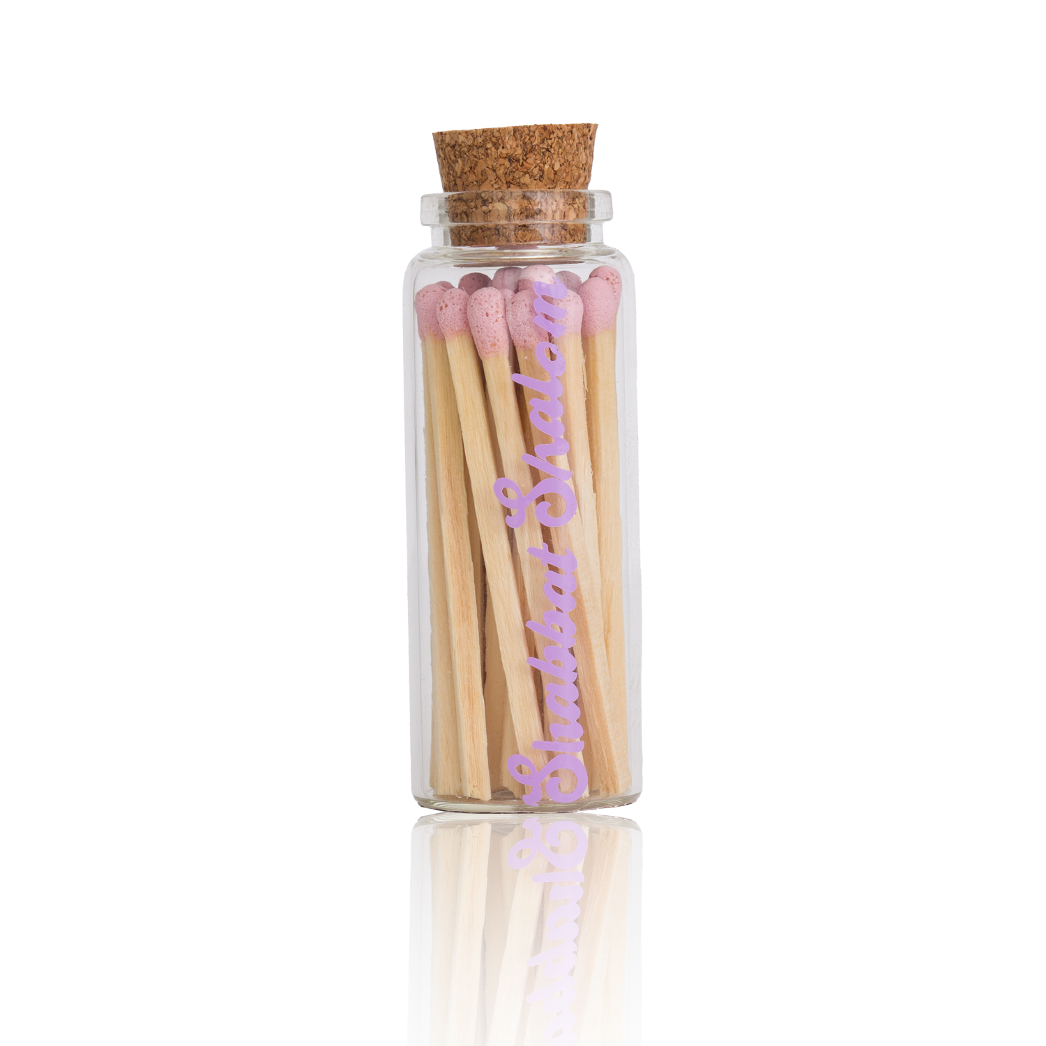 Handmade glass jar with cork lid filled with pink-tipped matches, labeled “Shabbat Shalom” 