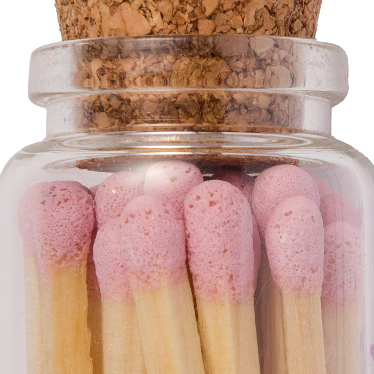 Handmade glass jar with cork lid filled with pink-tipped matches, labeled “Shabbat Shalom” close-up
