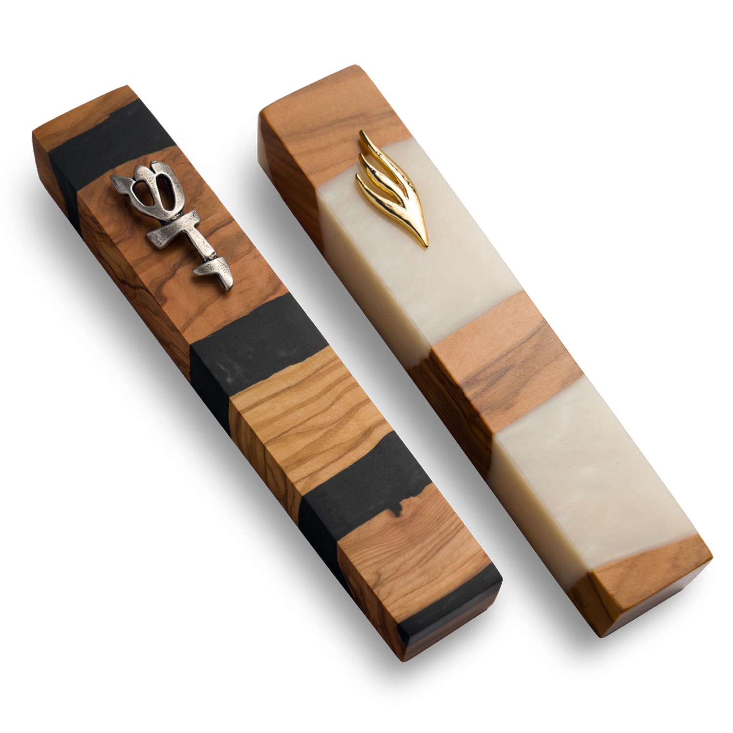 Handmade mezuzahs crafted from olive wood in black and white resin, featuring a silver and gold Shin symbol on the front.