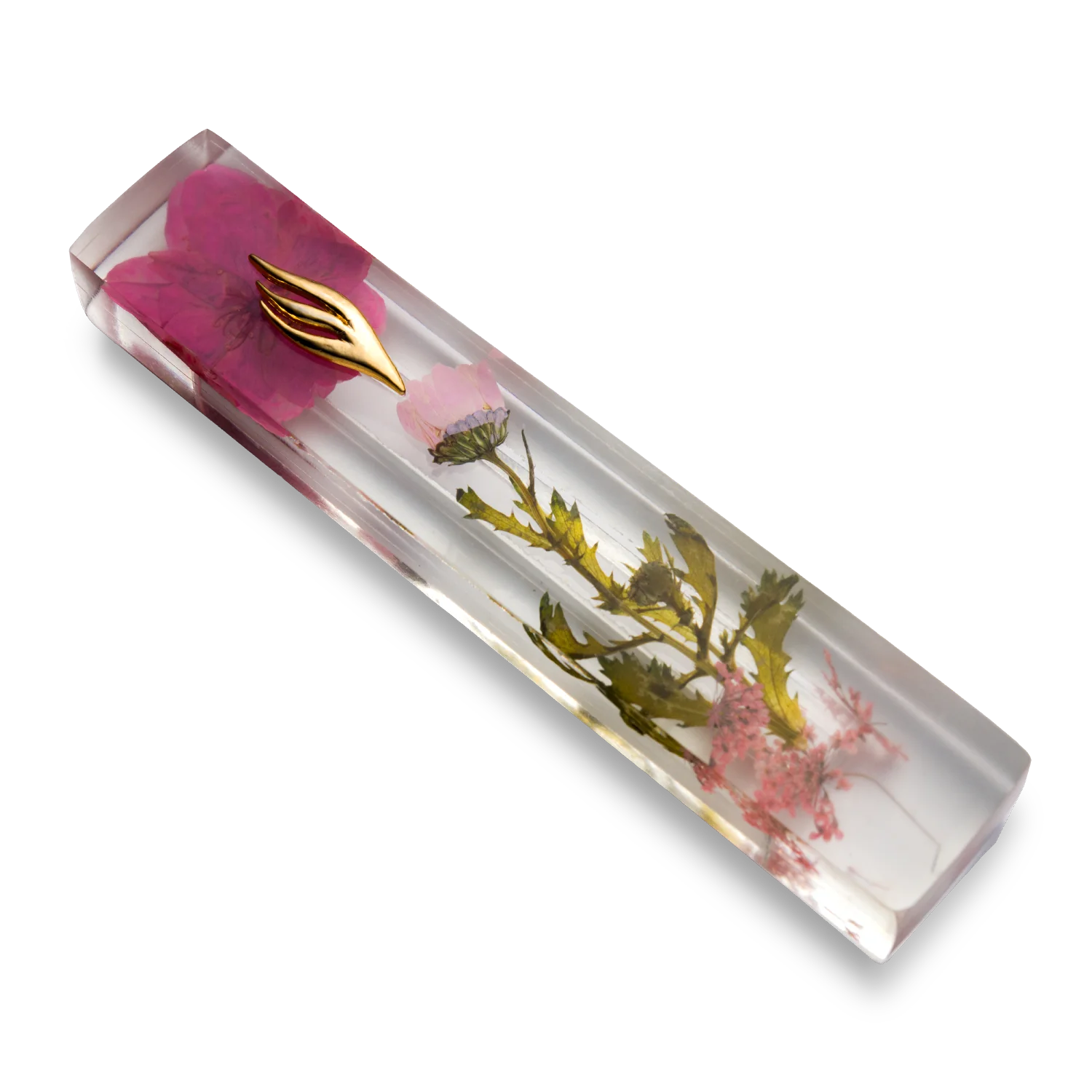 Handmade mezuzah crafted from clear resin and pink preserved flowers, featuring a golden Shin symbol on the front.