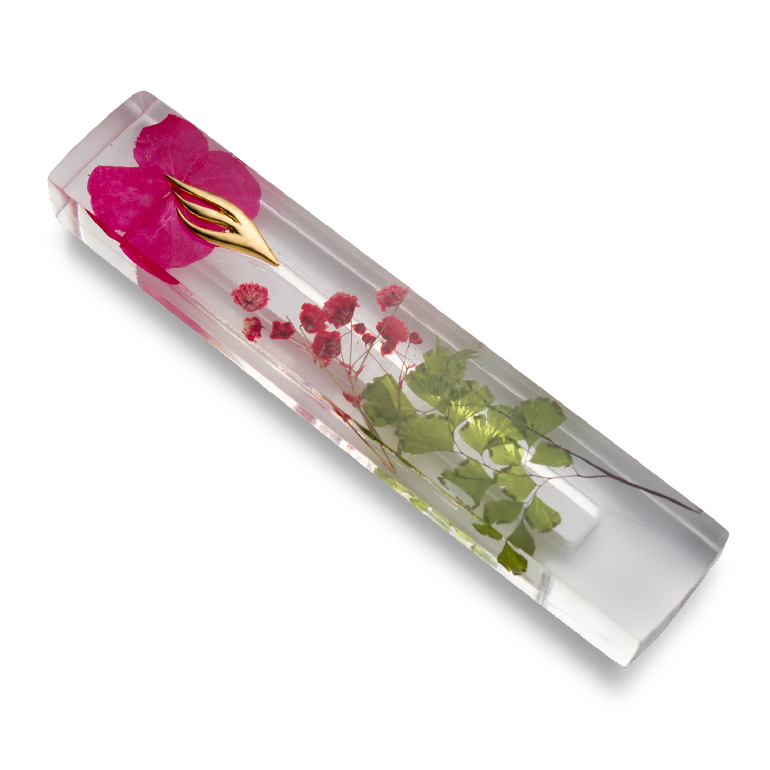 Handmade mezuzah crafted from clear resin and red preserved flowers, featuring a golden Shin symbol on the front.