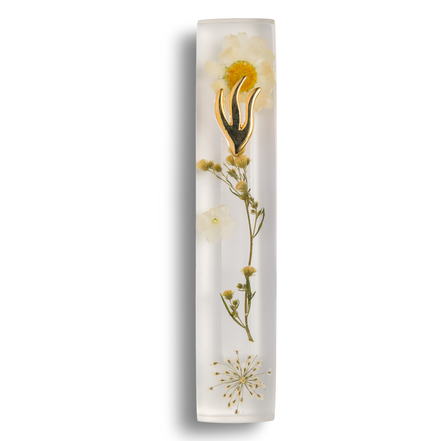 Handmade mezuzah crafted from clear resin and white preserved flowers, featuring a golden Shin symbol on the front.