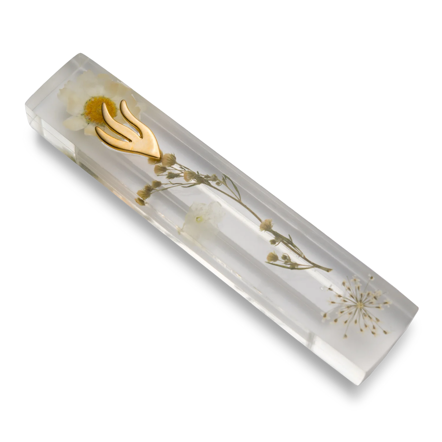 Handmade mezuzah crafted from clear resin and white preserved flowers, featuring a golden Shin symbol on the front.