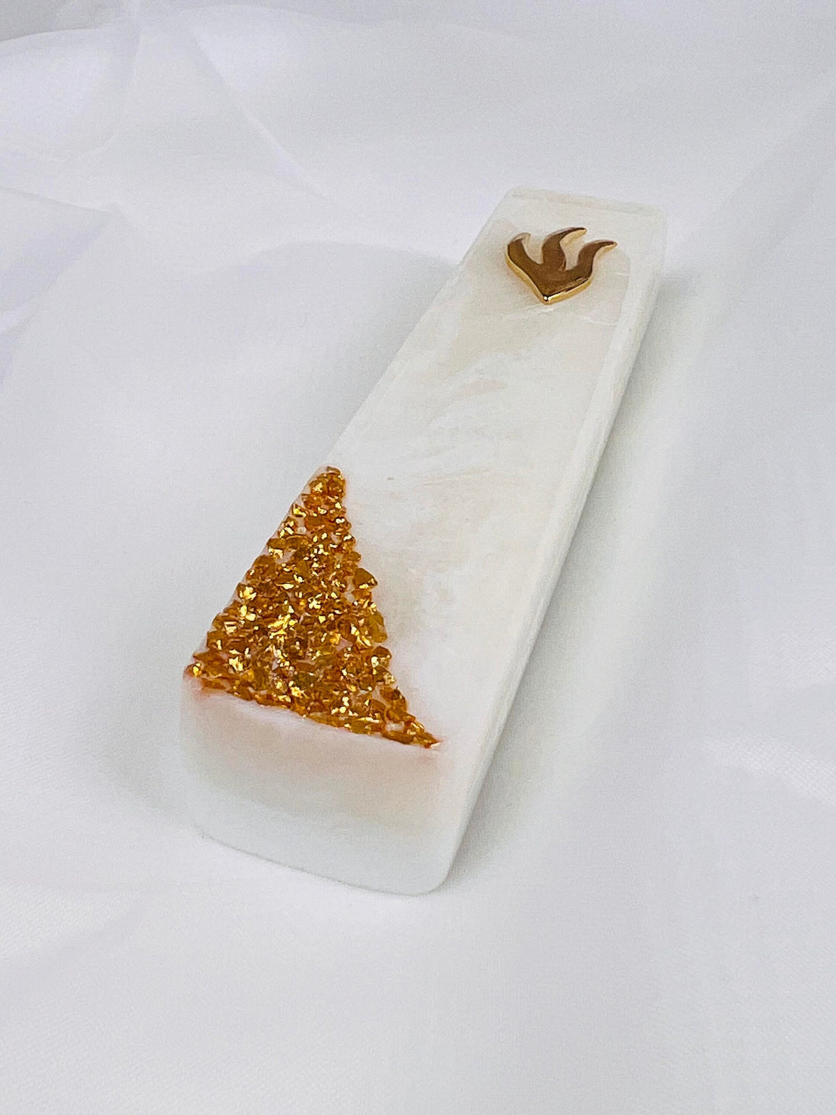 Handmade white marbled resin mezuzah case, detail of the gold glass
