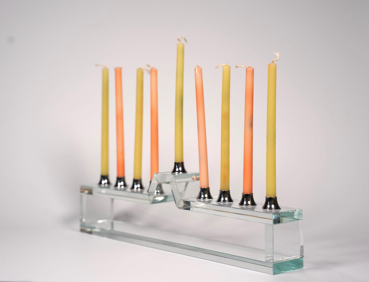 Handmade glass hanukkiah on a table