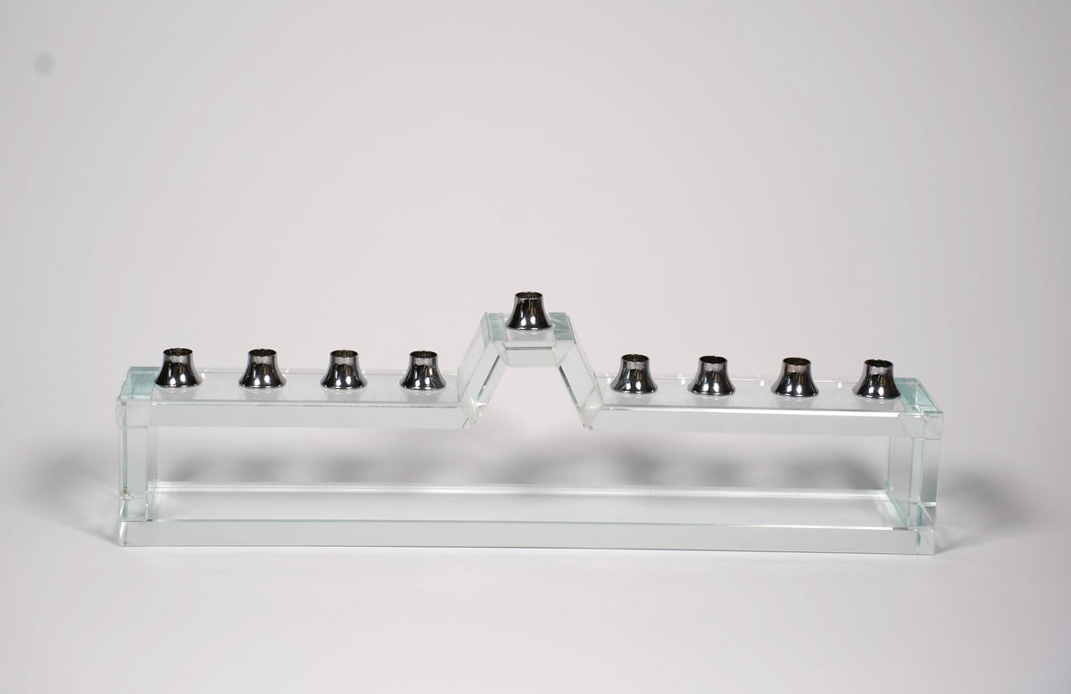 Handmade glass hanukkiah with candles