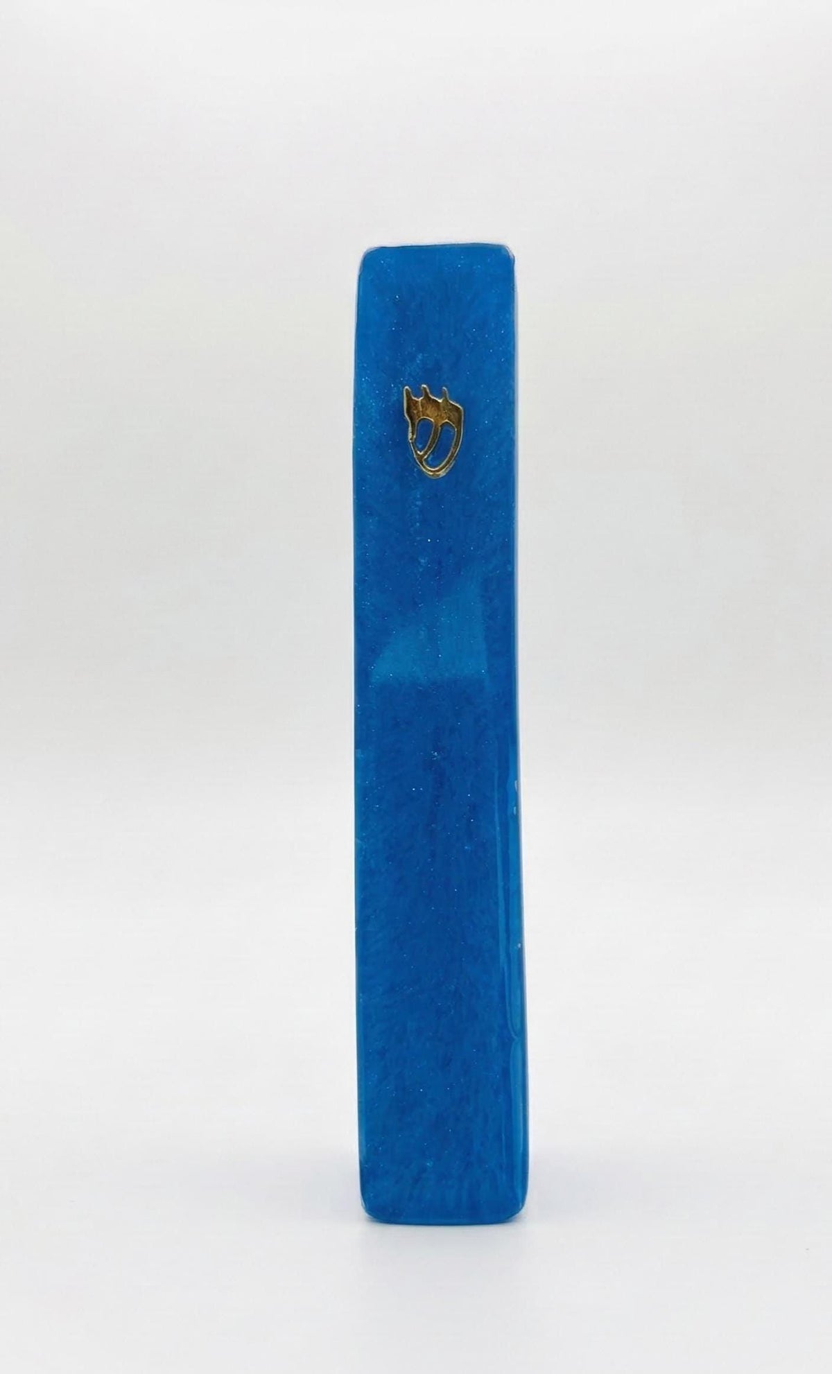 Handmade blue glitter resin mezuzah case on a doorpost