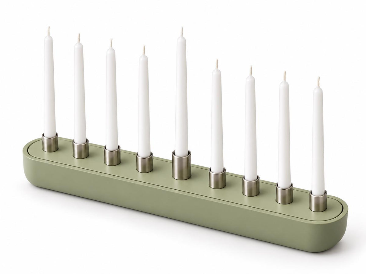Sage green hanukkiah on a table
