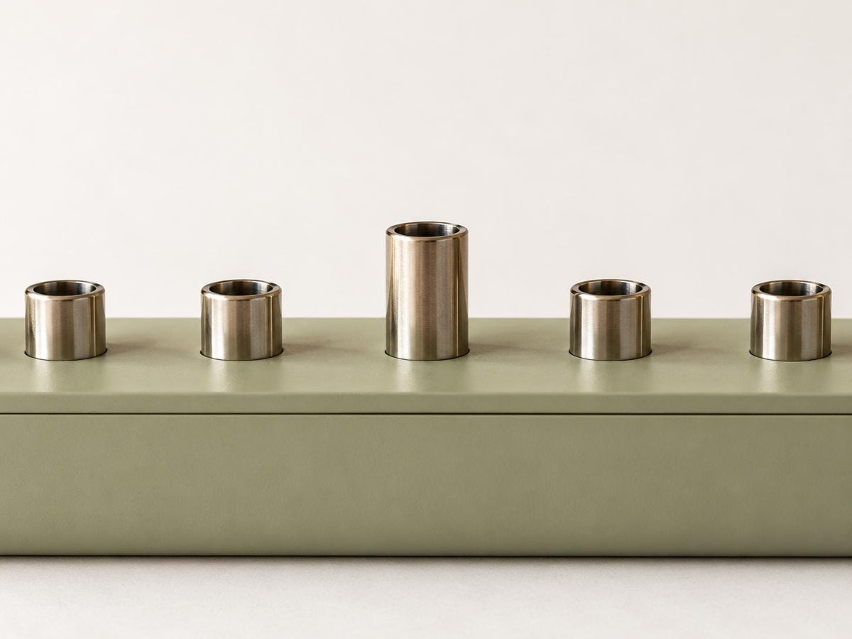 Sage green hanukkiah with white candles