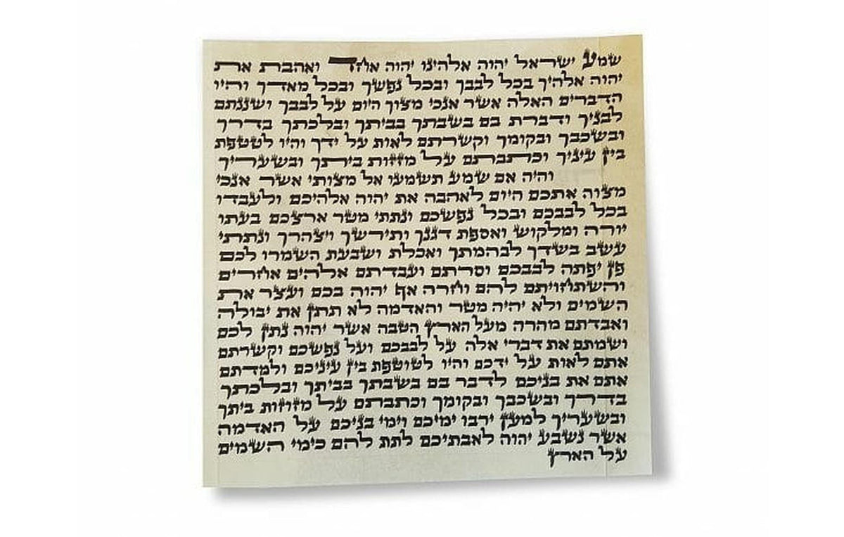 Kosher mezuzah scroll handwritten on parchment