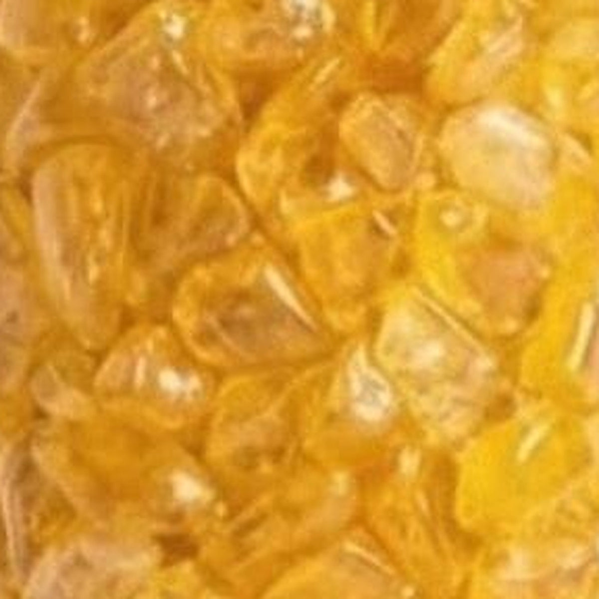 Yellow quartz crystal chips close-up